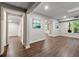 Spacious finished basement with neutral paint, windows, and hardwood floors at 4441 Langdon Se Walk, Smyrna, GA 30080