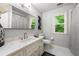 Updated bathroom with granite countertops, modern fixtures, and plenty of natural light at 4441 Langdon Se Walk, Smyrna, GA 30080