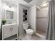 Basement bathroom featuring an updated vanity, a shower, and modern fixtures at 4441 Langdon Se Walk, Smyrna, GA 30080