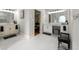 Bright bathroom featuring double sink vanities, white cabinets and tiled floors at 4441 Langdon Se Walk, Smyrna, GA 30080