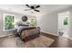 Bedroom featuring hardwood floors, a ceiling fan, and an en suite bathroom at 4441 Langdon Se Walk, Smyrna, GA 30080