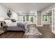 Finished basement bedroom featuring wood floors and walkout to backyard at 4441 Langdon Se Walk, Smyrna, GA 30080