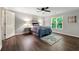 Cozy bedroom with a ceiling fan, and a large window overlooking a green yard at 4441 Langdon Se Walk, Smyrna, GA 30080