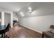Attic bedroom with skylight, wood floors, and space for a cozy setup at 4441 Langdon Se Walk, Smyrna, GA 30080