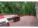 Spacious wooden deck surrounded by lush trees, featuring outdoor seating and a cozy atmosphere at 4441 Langdon Se Walk, Smyrna, GA 30080