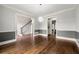 Dining room with hardwood floors that connects to the foyer and the kitchen at 4441 Langdon Se Walk, Smyrna, GA 30080