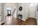 Welcoming foyer with hardwood floors, grand staircase, and elegant archway at 4441 Langdon Se Walk, Smyrna, GA 30080