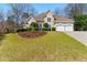 Beautiful two-story home with a manicured lawn, two-car garage, and arched entryway at 4441 Langdon Se Walk, Smyrna, GA 30080