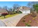 Well-maintained home boasting an attractive front lawn, a two-car garage, and appealing curb appeal at 4441 Langdon Se Walk, Smyrna, GA 30080