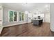 Open concept kitchen featuring hardwood floors and lots of natural light from the windows at 4441 Langdon Se Walk, Smyrna, GA 30080