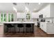 Well-lit kitchen showcases modern finishes, a center island with seating, and marble backsplash at 4441 Langdon Se Walk, Smyrna, GA 30080
