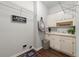 Functional laundry room with cabinetry, sink, and space for laundry appliances at 4441 Langdon Se Walk, Smyrna, GA 30080