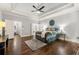 Comfortable main bedroom with hardwood floors, trey ceiling, and access to ensuite bathroom at 4441 Langdon Se Walk, Smyrna, GA 30080