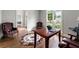 Home office featuring hardwood floors, large window, and traditional furniture at 4441 Langdon Se Walk, Smyrna, GA 30080