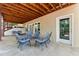 Covered outdoor patio with concrete flooring, an exposed wood ceiling, and patio furniture at 4441 Langdon Se Walk, Smyrna, GA 30080