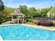 Community pool with gazebo and lounge chairs surrounded by lush landscaping at 4441 Langdon Se Walk, Smyrna, GA 30080