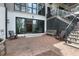 Exterior patio with brick pavers, overlooking manicured garden with outdoor furniture at 1025 Abingdon Ln, Johns Creek, GA 30022