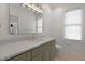 Bathroom featuring a marble countertop, modern sink faucet, vanity, and toilet at 1025 Abingdon Ln, Johns Creek, GA 30022