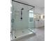 Bathroom featuring a glass shower, white subway tile, and a modern vanity with a mirror at 1025 Abingdon Ln, Johns Creek, GA 30022