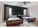 Bedroom featuring two beds, accent wall, and neutral carpet at 1025 Abingdon Ln, Johns Creek, GA 30022