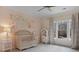 Cozy Bedroom featuring a mural, crib, window and neutral-colored walls at 1025 Abingdon Ln, Johns Creek, GA 30022