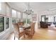Bright dining room features a chandelier, many windows and natural lighting at 1025 Abingdon Ln, Johns Creek, GA 30022