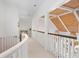 Hallway featuring wood ceilings, white railing, and neutral carpet at 1025 Abingdon Ln, Johns Creek, GA 30022