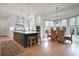 Bright kitchen with white cabinets, large island, and adjacent dining area at 1025 Abingdon Ln, Johns Creek, GA 30022