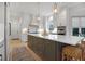 Bright kitchen with white cabinets, large island, and stainless steel appliances at 1025 Abingdon Ln, Johns Creek, GA 30022