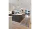 Open kitchen featuring a center island, modern lighting, and stainless steel appliances at 1025 Abingdon Ln, Johns Creek, GA 30022