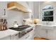 Bright kitchen with stainless appliances, a center island, and lots of natural light at 1025 Abingdon Ln, Johns Creek, GA 30022