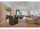 Open concept living room featuring high ceilings, a fireplace, and sliding doors to the backyard at 1025 Abingdon Ln, Johns Creek, GA 30022