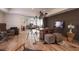 Stylish living room featuring hardwood floors, ample seating, and a large flatscreen television at 1025 Abingdon Ln, Johns Creek, GA 30022