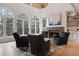 Bright living room featuring a fireplace, vaulted ceilings, and large arched windows at 1025 Abingdon Ln, Johns Creek, GA 30022