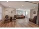 Bright living room featuring hardwood floors, ample seating, and natural light at 1025 Abingdon Ln, Johns Creek, GA 30022