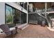 Brick patio with an outdoor seating area, overlooking the beautifully landscaped backyard at 1025 Abingdon Ln, Johns Creek, GA 30022