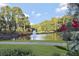 Scenic view of pond with fountain and lush greenery creates a peaceful atmosphere in the community at 1025 Abingdon Ln, Johns Creek, GA 30022