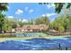 Exterior view of community center with tennis courts and play area showcasing the amenities available to residents at 1025 Abingdon Ln, Johns Creek, GA 30022