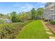 Lush backyard with a stone walkway leading to a gazebo surrounded by greenery at 2300 Habersham Marina Rd # 201, Cumming, GA 30041