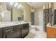 Bathroom featuring a tile floor, single sink vanity, and tub and shower combination at 2300 Habersham Marina Rd # 201, Cumming, GA 30041