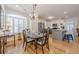 Elegant dining area with hardwood floors, a chandelier, and a view into the modern kitchen at 2300 Habersham Marina Rd # 201, Cumming, GA 30041