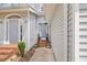Exterior entrance of townhome, highlighting the front door, potted plants, and well-maintained walkway at 2300 Habersham Marina Rd # 201, Cumming, GA 30041