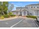 Charming townhouse exterior with manicured landscaping and convenient parking at 2300 Habersham Marina Rd # 201, Cumming, GA 30041