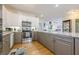 Eat-in kitchen featuring stainless steel appliances, granite countertops, and hardwood floors at 2300 Habersham Marina Rd # 201, Cumming, GA 30041