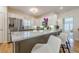 Eat-in kitchen featuring stainless steel appliances, granite countertops, and counter seating at 2300 Habersham Marina Rd # 201, Cumming, GA 30041