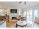 Living room featuring hardwood floors, fireplace, and sliding glass door to outdoor patio at 2300 Habersham Marina Rd # 201, Cumming, GA 30041