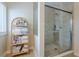 Modern shower with tiled walls and glass doors with a nice storage rack nearby at 2300 Habersham Marina Rd # 201, Cumming, GA 30041