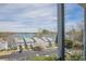 Scenic view of the lake and the property's buildings, visible from an upper floor at 2300 Habersham Marina Rd # 201, Cumming, GA 30041