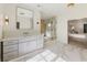 Bright bathroom featuring modern fixtures, large vanity, marble floors, and glass-enclosed shower at 295 Pebble Trl, Alpharetta, GA 30009