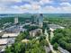 Beautiful aerial view showcasing city skyline and community neighborhood, conveniently surrounded by green spaces at 2965 Pharr Court South Nw # 102, Atlanta, GA 30305